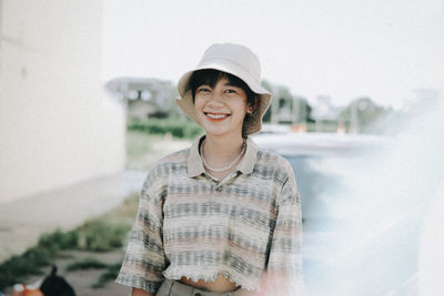 Portrait of a smiling young man wearing hat