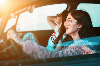 Portrait of woman sitting in car