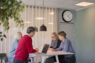 People taking during business meeting