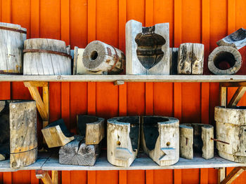 Wooden art arranged on shelf