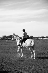 Rural scene boy riding horse