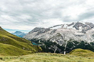 Panoramic view of lake fedaia and the marmolada glacier