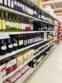 Row of bottles on display at store