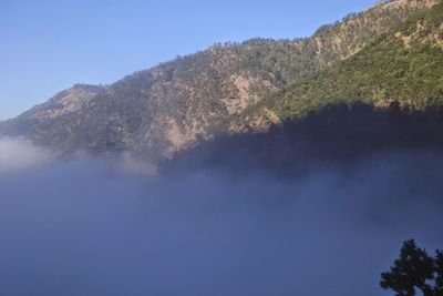 Scenic view of mountains against clear blue sky