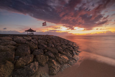 Scenic view of sea against sky at sunset