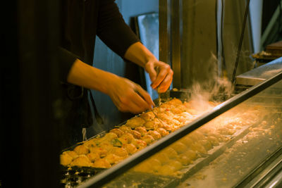 Midsection of person preparing food