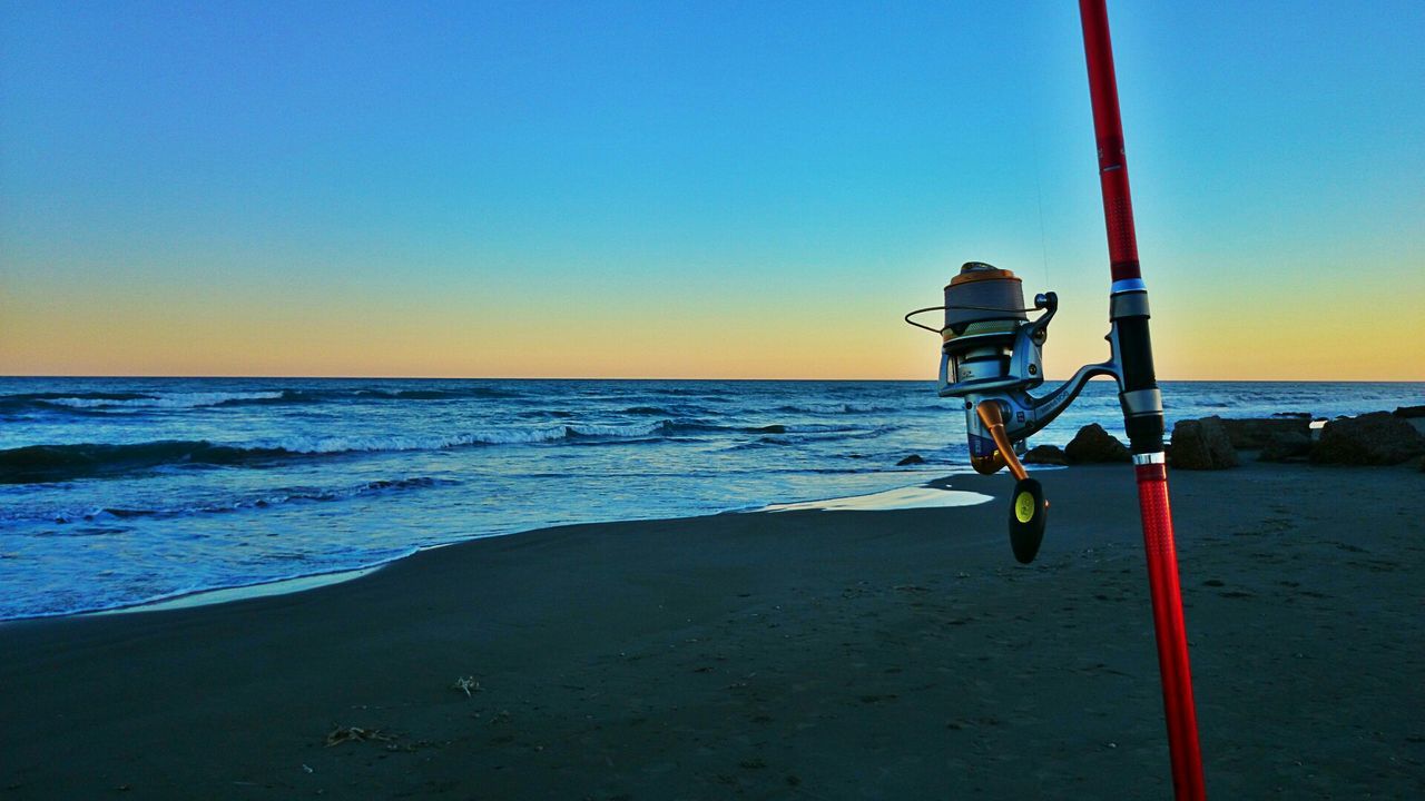 sea, horizon over water, beach, water, shore, clear sky, scenics, tranquility, tranquil scene, copy space, beauty in nature, sand, sunset, wave, nature, protection, safety, sky, idyllic, lifeguard hut