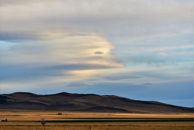 Scenic view of landscape against sky during sunset