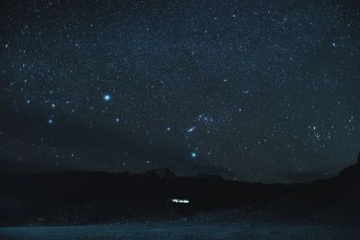 Scenic view of star field against sky at night