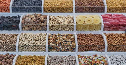 A counter with dried fruits and nuts at the authentic bazaar of a resort town