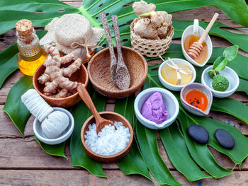 High angle view of herbs in bowls on table