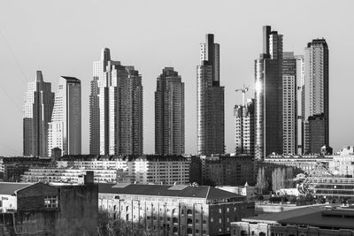 Modern buildings against clear sky