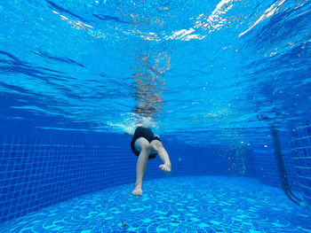 Man swimming in pool