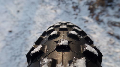 Low angle view of snow against sky during winter