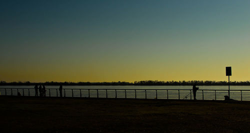 Scenic view of sea against clear sky during sunset