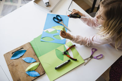 Girl making paper craft