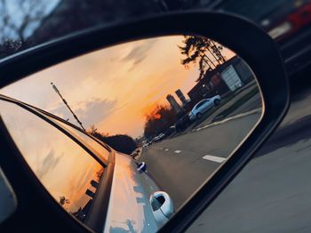 Reflection of car on side-view mirror