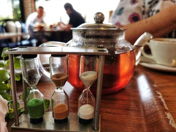 Close-up of hourglass on table