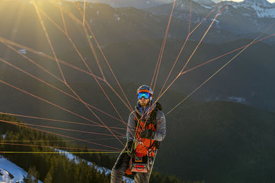 High angle view of man on mountain against sky