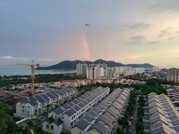 High angle view of buildings against sky during sunset