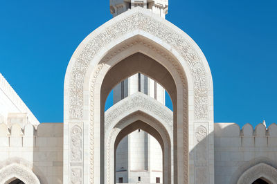 Low angle view of historical building against blue sky