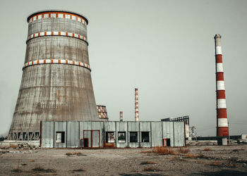 Low angle view of factory against clear sky