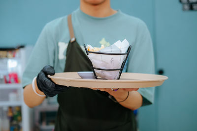 Midsection of woman using mobile phone