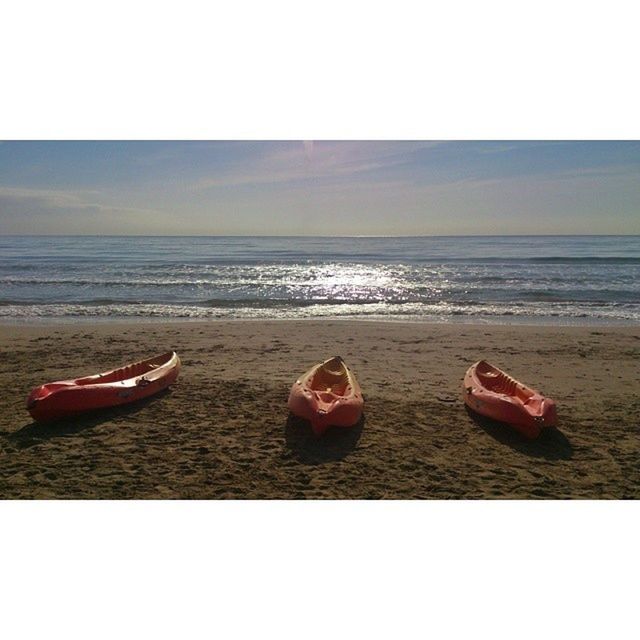 horizon over water, sea, beach, water, transfer print, sand, shore, sky, auto post production filter, nautical vessel, transportation, tranquility, boat, scenics, tranquil scene, nature, beauty in nature, mode of transport, red, outdoors