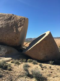 Sand dunes in desert against clear sky