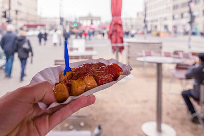 Close-up of hand holding food