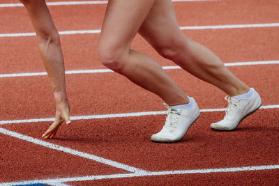 Low section of man running track