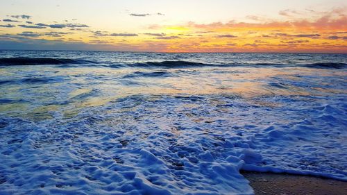 Scenic view of sea at sunset