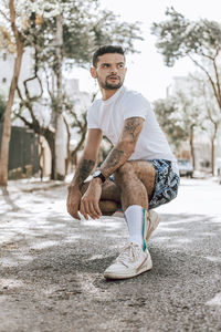 Portrait of young man on street