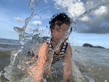 Portrait of man swimming in sea