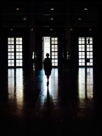 Woman walking in corridor