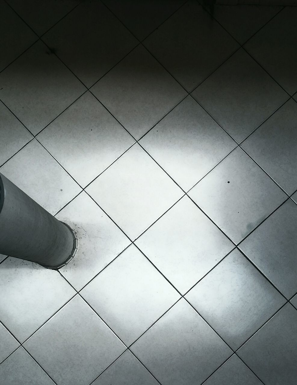 tiled floor, human body part, pattern, indoors, low section, real people, one person, human leg, close-up, day, people