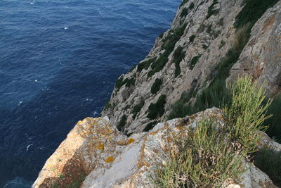 High angle view of rocks by sea