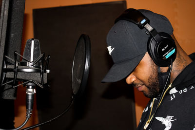 Midsection of man using mobile phone