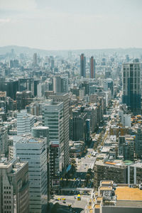 High angle view of buildings in city against sky