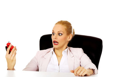 Portrait of a beautiful young woman over white background