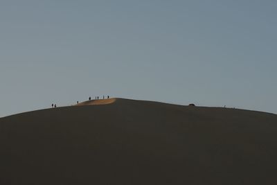 Scenic view of desert against clear sky