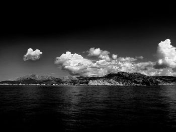 Scenic view of mountains against cloudy sky