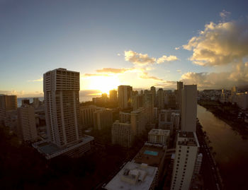 High angle view of buildings against sky during sunset