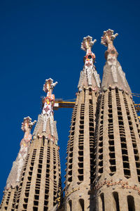 Low angle view of building against blue sky