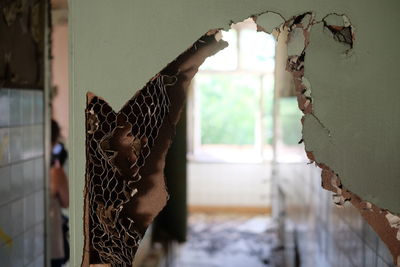 Broken door in abandoned house