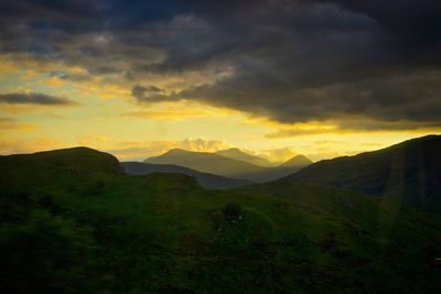 Scenic view of landscape against sky during sunset