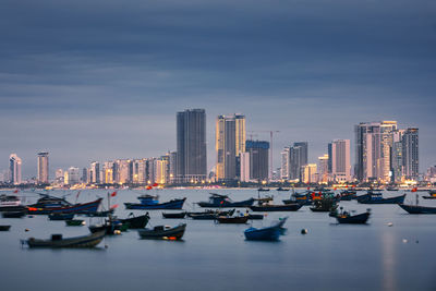 Boats moored at harbor