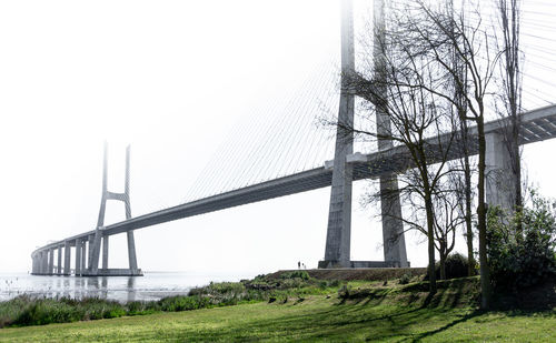 Bridge on field against sky