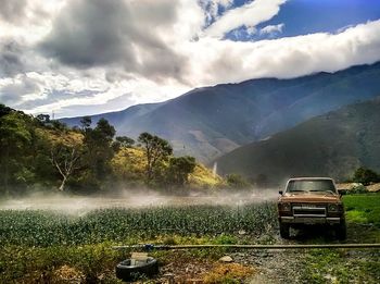 Scenic view of agricultural field against sky