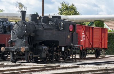 Train on railroad track against sky